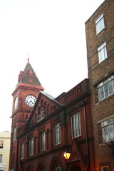 Fototapeta na wymiar Clock tower in the town scene.