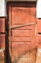 old doors to the basement wooden with cracked paint