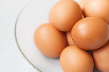 Eggs in the glass plate close up