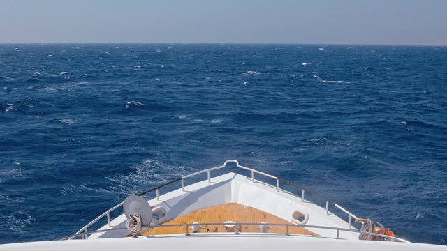 Yacht heading toward the horizon on the sea