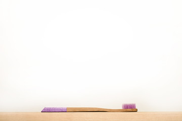 liliac  colours bamboo toothbrushes on white background. Place for text. Ecoproduct.   eco-friendly.