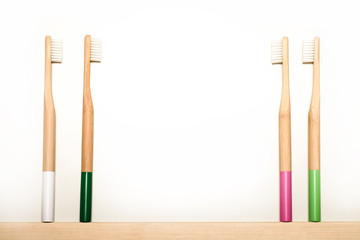 full colours bamboo toothbrushes on white background. Place for text. Ecoproduct.   eco-friendly.