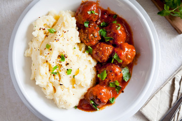 Bowl Of Meatballs With Tomato Sauce And Mashed Potatoes