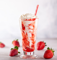 Strawberry milkshake with whipped cream.