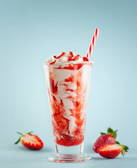Strawberry milkshake with whipped cream.