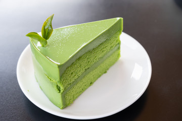 Green tea cake with organic tea on top of cake at Choui fong tea farm.