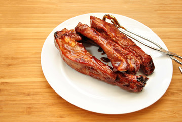 Saucey Barbequed Pork Ribs on a White Plate