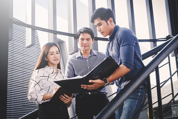 Discussing plan and idea to improvement strategy, businessmen brainstorming for strategy of...