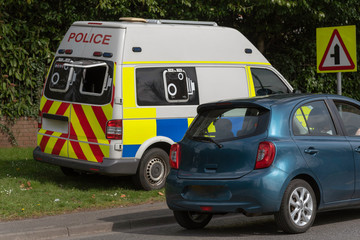 . April 2019. Police van parked on a grass verge with  a rear camera checking for speeding motorists