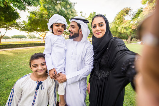 Happy arabian family in a park