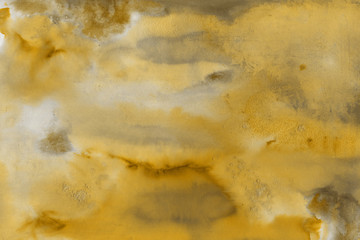 Yellow spring watercolor texture with abstract washes and brush strokes on the white paper background. Chaotic abstract organic design.