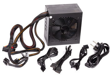 pc atx half-modular power supply isolated on white background with selective focus