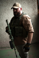 Fototapeta premium Armed soldier ready for battle. Military concept.