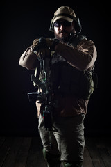 Fototapeta na wymiar Armed soldier ready for battle. Military concept.