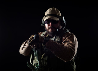 Armed soldier ready for battle. Military concept.