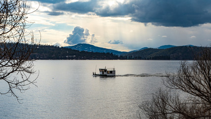 Fototapeta na wymiar Boat very low on Lake Couer d'Alene Idaho