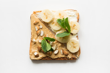 Different types of sandwiches for healthy and sugar-free children's breakfast, nut paste, bananas.