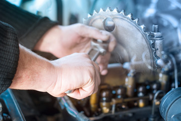 car repair concept, auto mechanic hands servicing engine mechanisms, close-up, multiexposure
