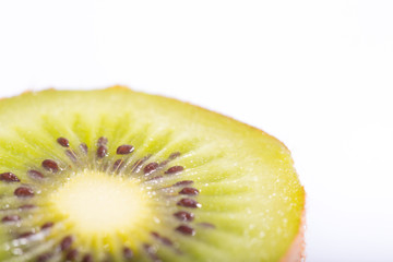 Close up detail of green fresh kiwi fruit on white background
