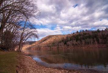 The Allegheny River valley in Warren County, Pennsylvania, USA in springtime under vibrant skies