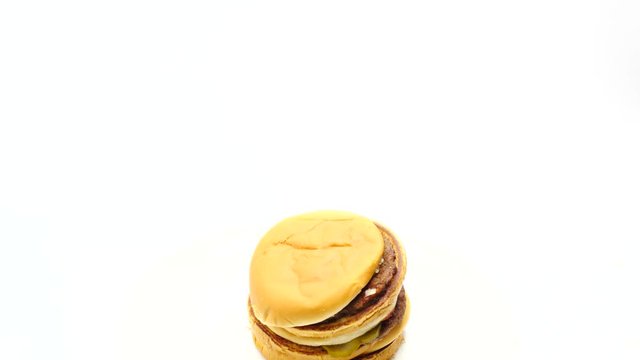 Woman stacking beef burgers on top of one another
