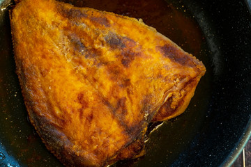 Fried flounder. Home cooking in a rustic style.