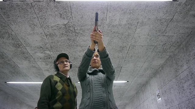 Blonde Girl Firing Gun