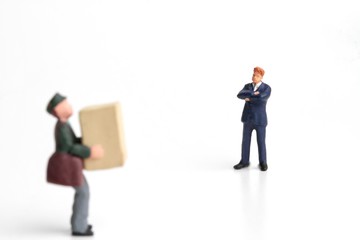 miniature of a deliveryman holding a parcel