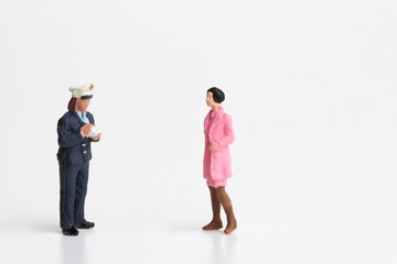 Naklejka premium miniature of a policewoman writing a ticket for a violation