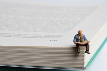 miniature of people reading 