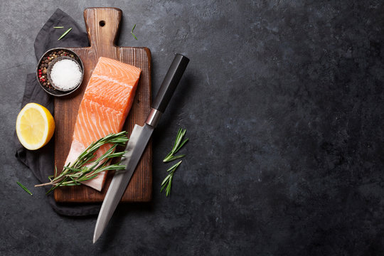 Raw salmon fish fillet and ingredients for cooking