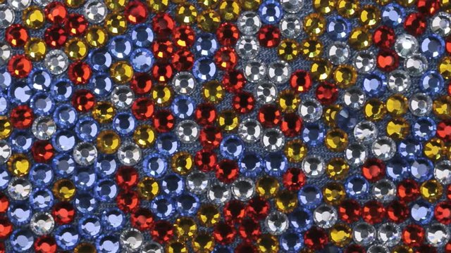 Rotation of multi-colored rhinestones with beautiful light reflections.