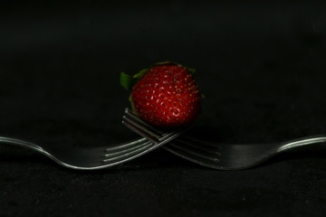 strawberry on forks