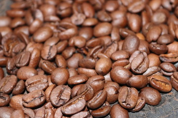 Coffee beans and scattered on the background. - Image