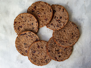 Amazing Chocolate Easter Cake with chocolate drops and dry cherries on gray wooden background. Round slices of cake. Easter concept. Selective focus, close up