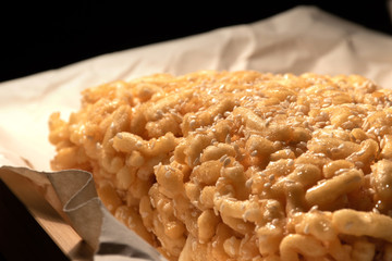 Sweet asian cake chak-chak with honey on wooden board