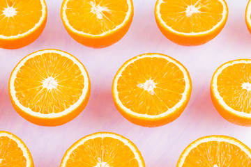 Background of oranges fruits. Many halves of fresh oranges, top view. Citrus for making juice. A...