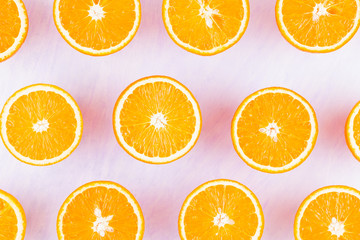 Background of oranges fruits. Many halves of fresh oranges, top view. Citrus for making juice. A lot of sliced oranges on a white background. Concept