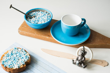 rusk with blue and white aniseed balls,  Dutch Muisjes, traditional food in The Netherlands when a baby boy is born