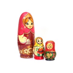 Traditional Russian wooden toy "Matryoshka" isolated on white background