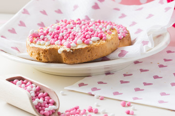 rusk with white and pink aniseed balls, DutchMuisjes, traditional food in The Netherlands when a baby girl is born