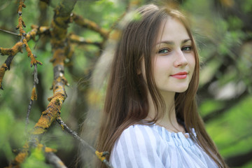 A girl in a spring green park