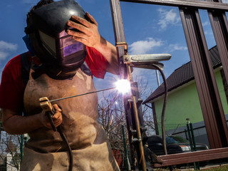 Man is welded to a steel gate metal latch.