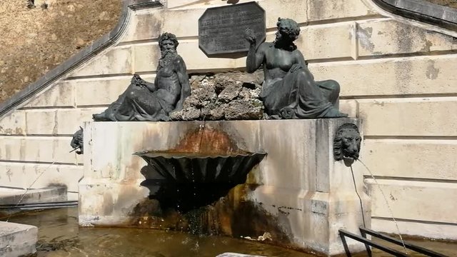 Pettorano sul Gizio, Abruzzo, Italy - March 15, 2019: Monumental fountain of Neptune and Amphitrite along the side facade of the mother church
