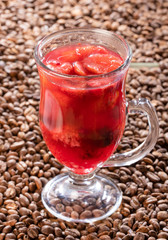 Red fruit tea - Coffee beans background. Vertical