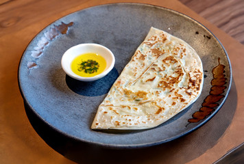 Kutab, a traditional Arabic dish, lies on a plate