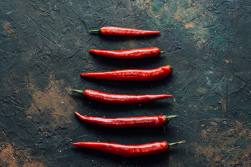 Red pepper on black background.Spicy.Food concept.Top view.Vegetable menu.To describe spicy...