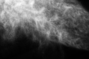 A stream of water and a cloud of drops