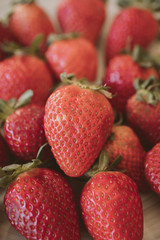 Fresh strawberry background. Close up view of red ripe strawberries.  