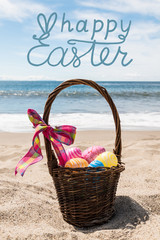 Easter bunny with color eggs on the ocean beach